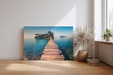 Sinus Art Wandbild 120x80cm Holzsteg führt zur Insel im klaren Meer – Symbol für Freiheit und Fernweh