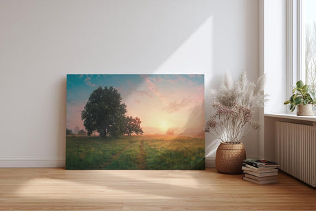 Sinus Art Wandbild 120x80cm Grüne Wiese im goldenen Morgenlicht mit Baumgruppe für eine friedliche Raumwirkung