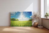 Sinus Art Wandbild 120x80cm Weite Frühlingswiese mit gelben Blüten und strahlendem Himmel für fröhliche Atmosphäre