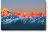 Sinus Art Wandbild 120x80cm Leuchtend rote Bergspitzen im ersten Sonnenlicht mit kühler Schneelandschaft