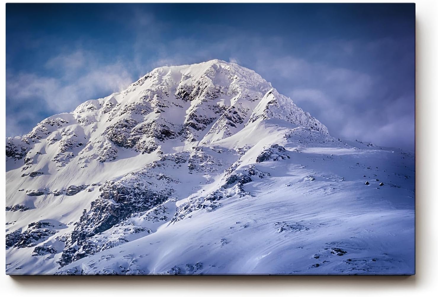 Sinus Art Wandbild 120x80cm Imposanter Schneegipfel unter blauem Himmel mit Licht- und Schattenspiel