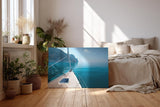 Sinus Art Wandbild 120x80cm Ruhiger Ausblick von einem Segelboot über das glitzernde Wasser zur felsigen Küste