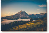 Sinus Art Wandbild 120x80cm Alpenmassiv im goldenen Licht des Sonnenaufgangs über grünen Hügeln