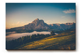 Sinus Art Wandbild 120x80cm Alpenmassiv im goldenen Licht des Sonnenaufgangs über grünen Hügeln