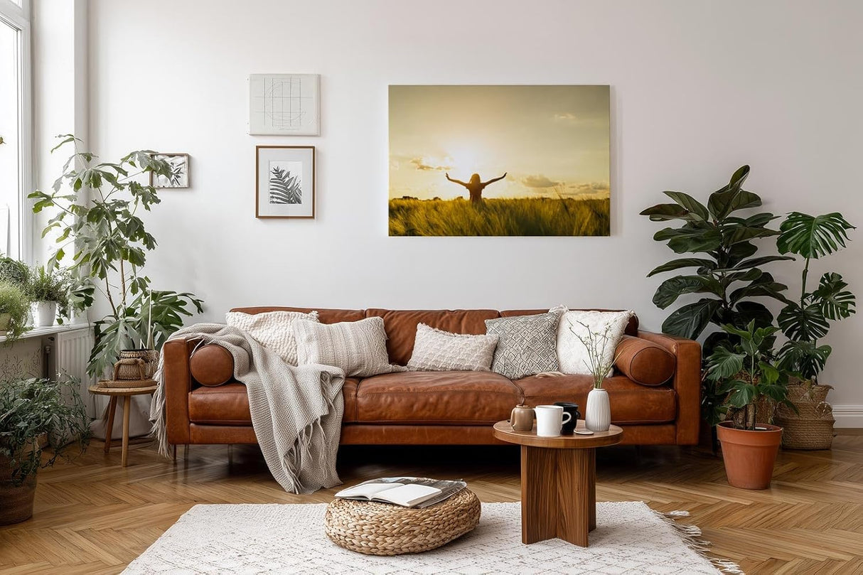 Sinus Art Wandbild 120x80cm Stimmungsvolle Silhouette einer Frau mit erhobenen Armen in einem goldenen Weizenfeld