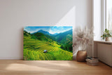Sinus Art Wandbild 120x80cm Gestufte Reisterrassen in leuchtendem Grün vor Bergkulisse und weitem Himmel