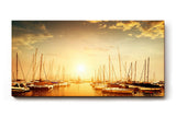 Sinus Art Wandbild 120x80cm Wunderschöner Sonnenuntergang über ruhigem Wasser mit segelnden Booten