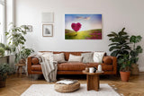 Sinus Art Wandbild 120x80cm Herzförmiger Baum in pinker Blüte in weiter Frühlingslandschaft mit Blumenwiese