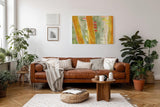 Sinus Art Wandbild 120x80cm Gelb-orange vertikale Pinselstriche auf grünlichem Grund mit leuchtenden Akzenten