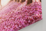 Sinus Art Wandbild 120x80cm Märchenhafter Weg unter rosa Blütenbäumen mit Perspektive und Tiefe
