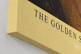 Paul Sinus Wandbild in 40x60cm The Golden Secret – Intensives Porträt mit goldener Blattoptik und blauem Auge in Nahaufnahme
