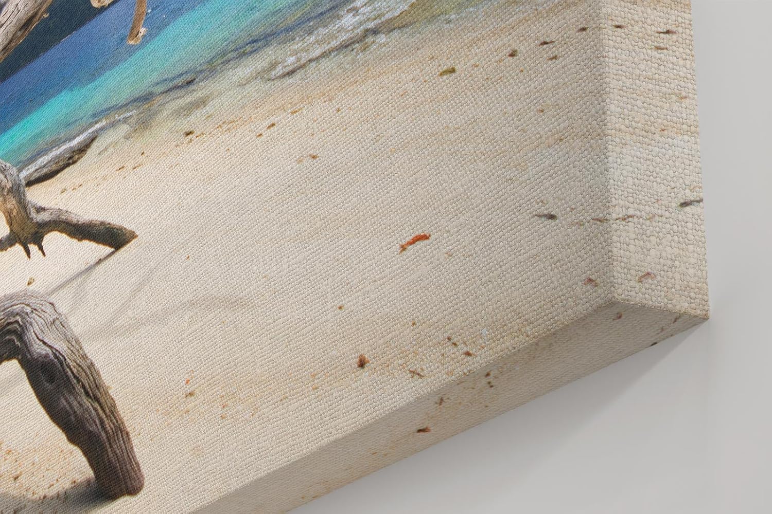 Sinus Art Wandbild 120x80cm Faszinierendes Motiv mit Treibholz am weißen Sandstrand vor türkisfarbenem Meer