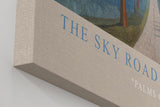 Paul Sinus Wandbild in 40x60cm The Sky Road mit Palmenallee und dramatischem Wolkenhimmel vor blauen Bergen für eindrucksvolle Wandgestaltung