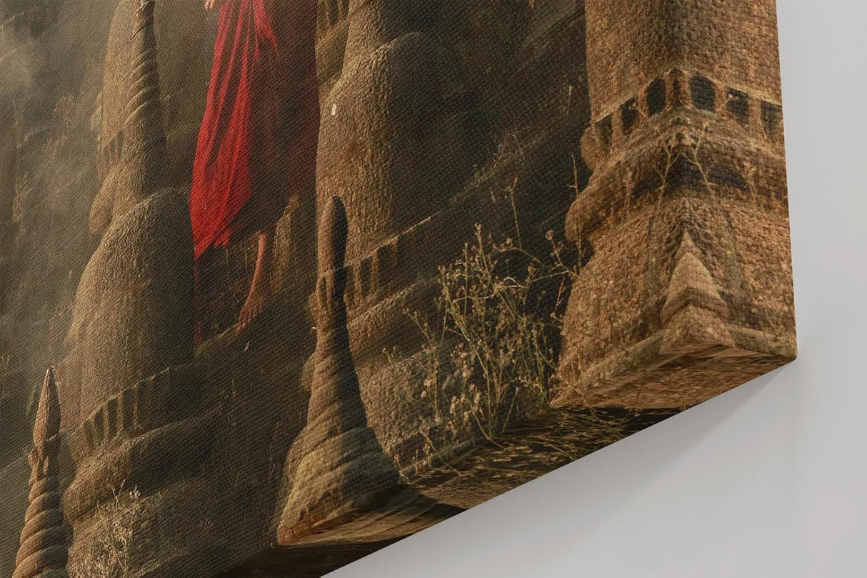 Sinus Art Wandbild 120x80cm Junger Mönch mit Schirm zwischen alten Stupas – Symbol für Glaube und Einkehr