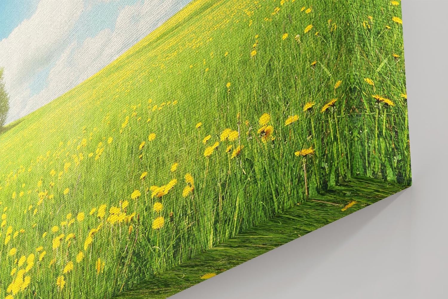 Sinus Art Wandbild 120x80cm Weite Frühlingswiese mit gelben Blüten und strahlendem Himmel für fröhliche Atmosphäre
