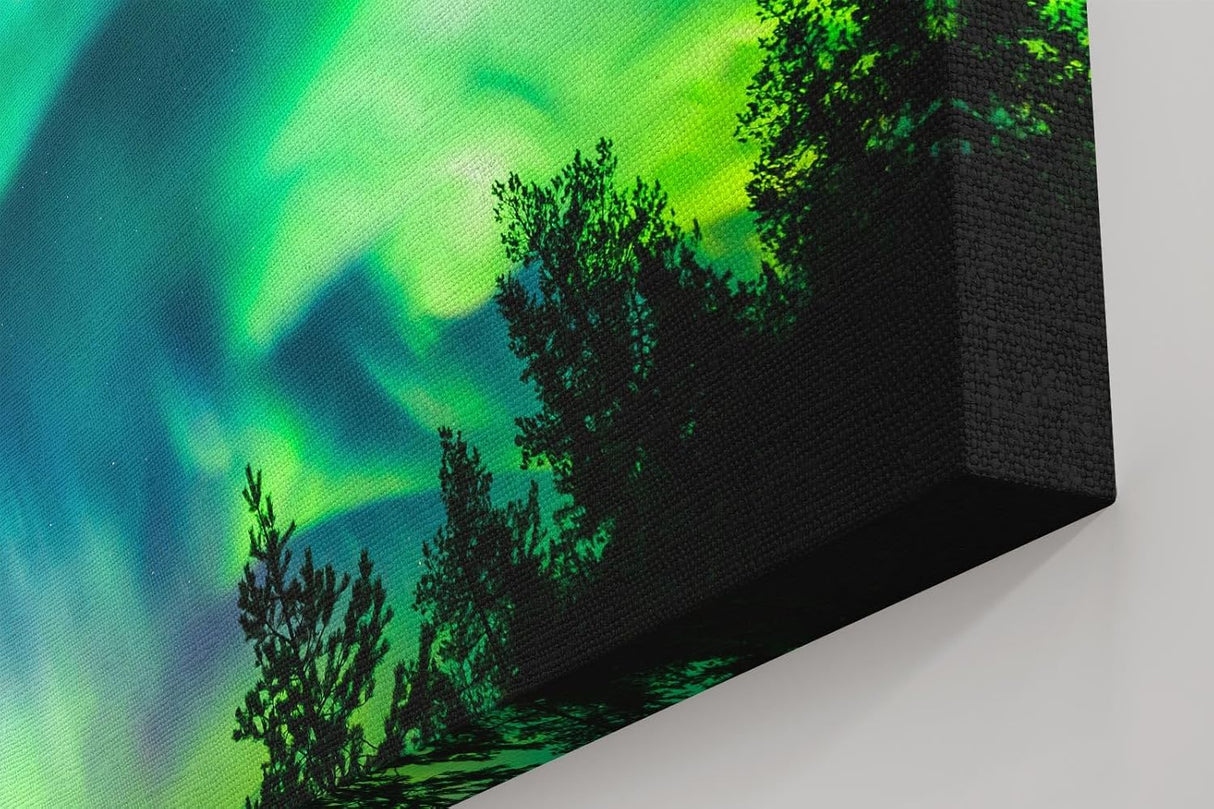 Sinus Art Wandbild 120x80cm Atemberaubende Aurora Borealis mit dynamischem Farbspiel über Silhouetten dunkler Bäume