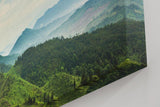 Sinus Art Wandbild 120x80cm Weite grüne Hügel und Berge unter wolkenverhangenem Himmel mit Lichteinfall