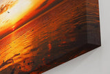 Sinus Art Wandbild 120x80cm Imposanter Sonnenuntergang mit Spiegelungen auf der Wasseroberfläche und fliegenden Vögeln