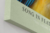 Paul Sinus Wandbild in 40x60cm Song in Feathers – farbenfrohes Vogelporträt in harmonischen Blauund Gelbtönen für stilvolle Raumgestaltung