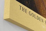 Paul Sinus Wandbild in 40x60cm The Golden Secret – Intensives Porträt mit goldener Blattoptik und blauem Auge in Nahaufnahme