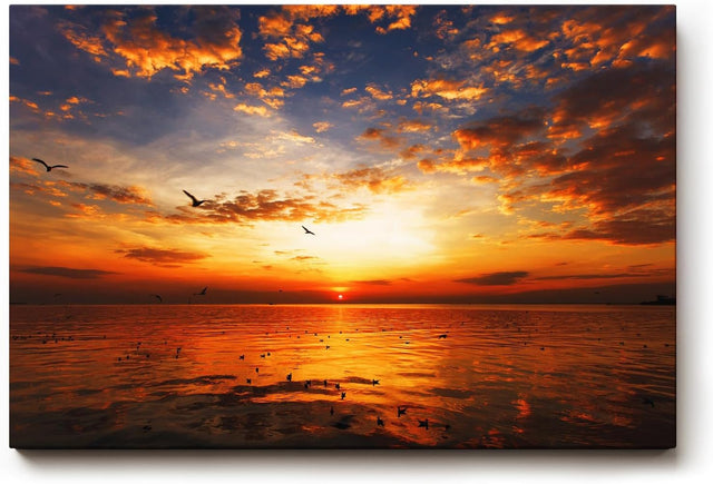 Sinus Art Wandbild 120x80cm Imposanter Sonnenuntergang mit Spiegelungen auf der Wasseroberfläche und fliegenden Vögeln